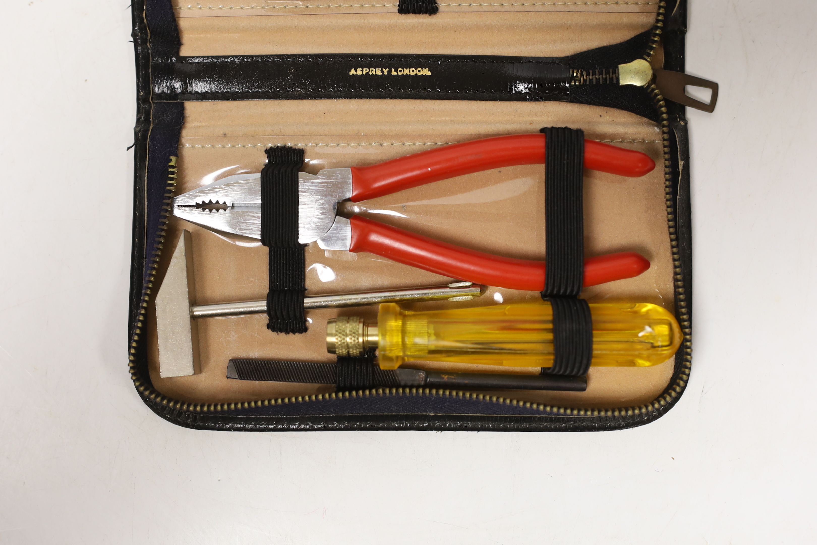 An Asprey case with associated tool set, case 17cm wide